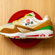A sneaker has been placed on a red plate on a table.